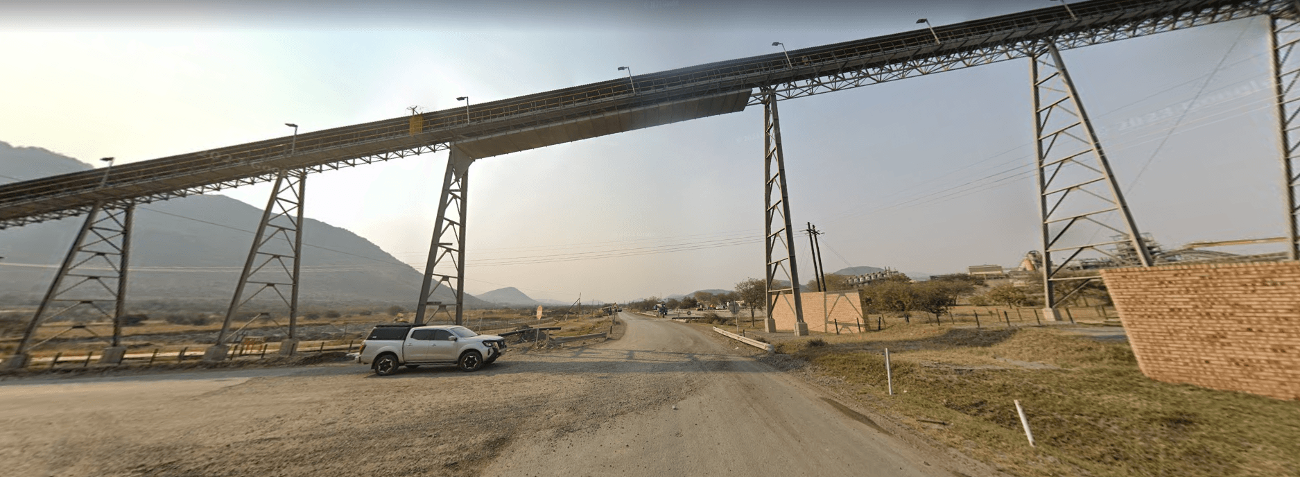 Conveyors and haul routes extend the story beyond a single pit.